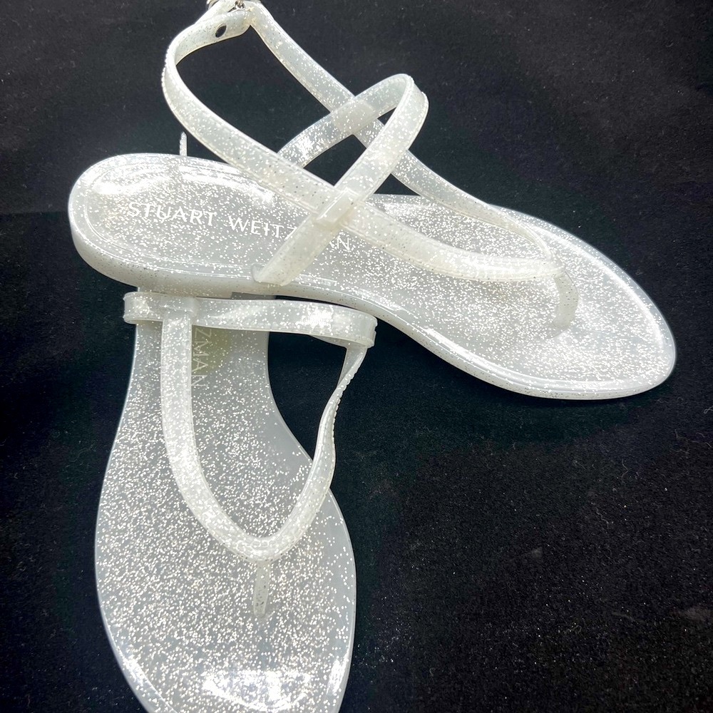 Never worn Stuart Weitzman Gray/Silver/ sparkle thong style flat sandals.